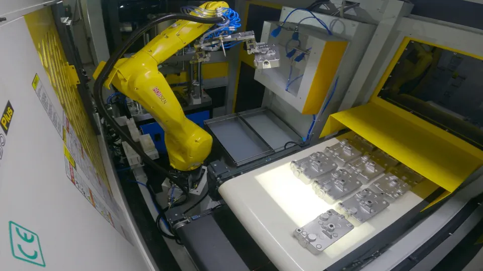 Robot over the backlit conveyor
