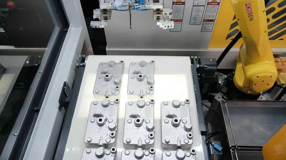 Aluminum housings lined up on the conveyor