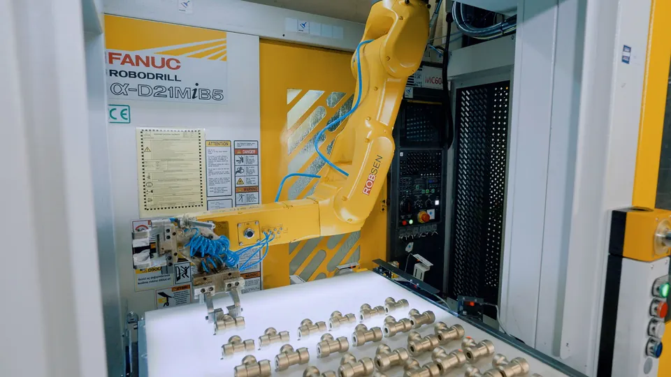The robot reaching into the Robodrill