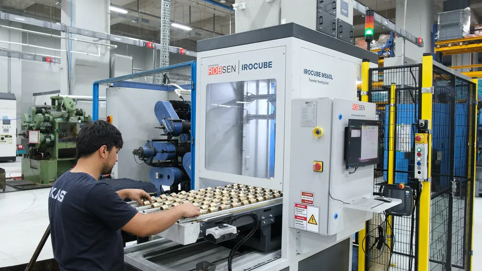 Loading raw brass parts while the cell runs