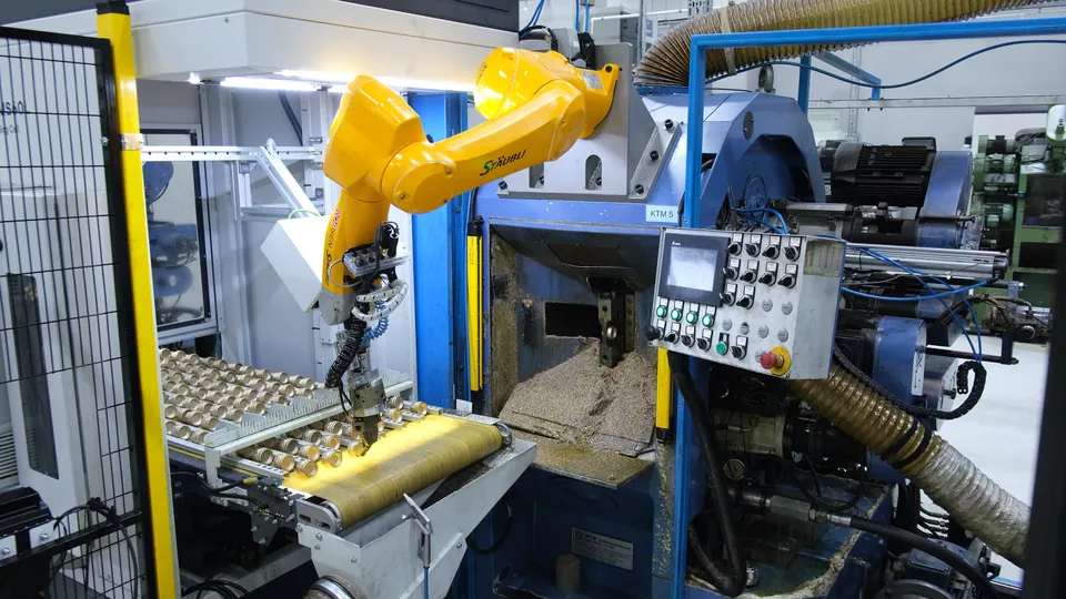 IROVISION locates the part on the backlit conveyor; the robot picks it