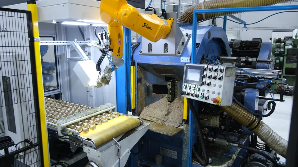 A second camera checks the part in the gripper