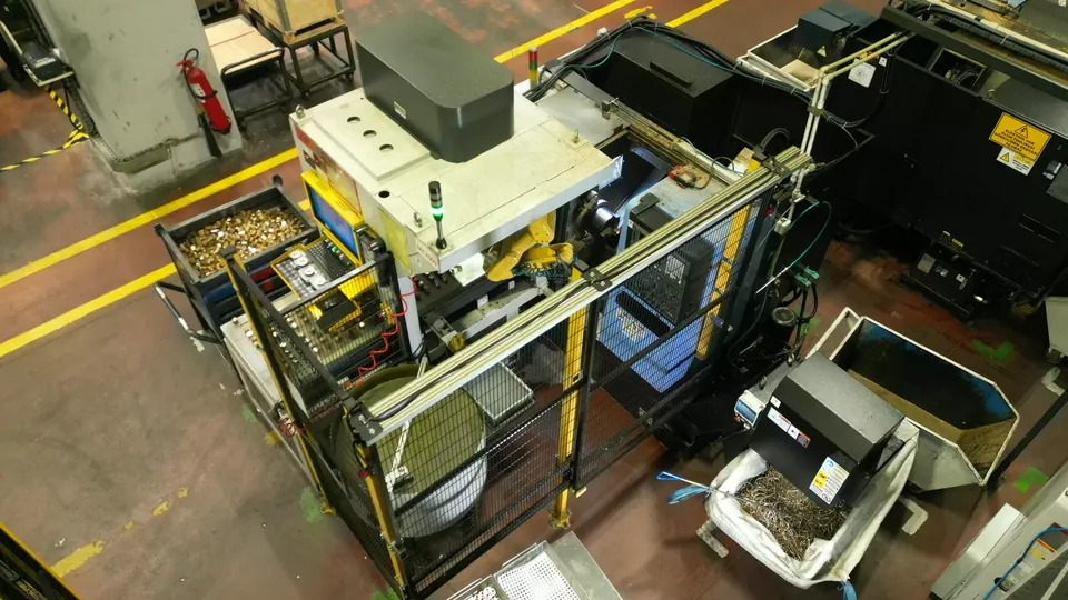 T Series cell from above: conveyor, robot and lathe